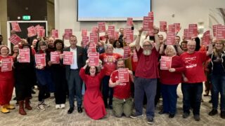 Activists show support for show racism the red card by wearing red.