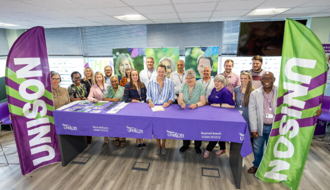 Susan Halliwell, Chief Executive of Bracknell Forest Council, signs the charter with activists from Bracknell and District Branch