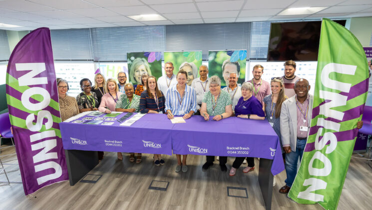 Susan Halliwell, Chief Executive of Bracknell Forest Council, signs the charter with activists from Bracknell and District Branch