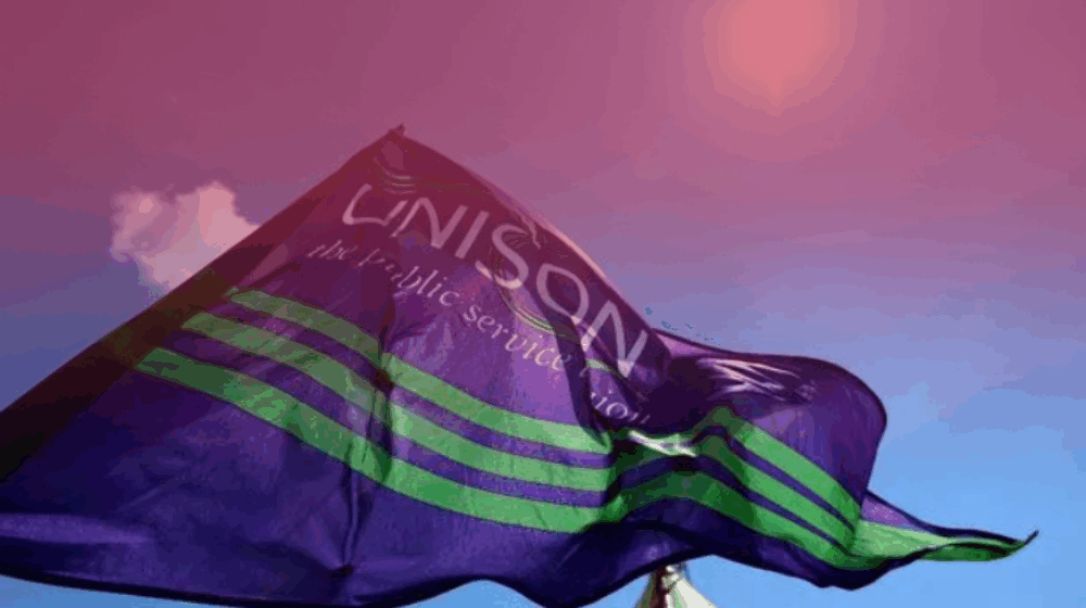 A UNISON flag waves in the wind
