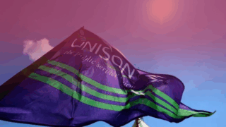A UNISON flag waves in the wind