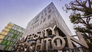 Frontage of a tall building at the campus of the University of Brighton