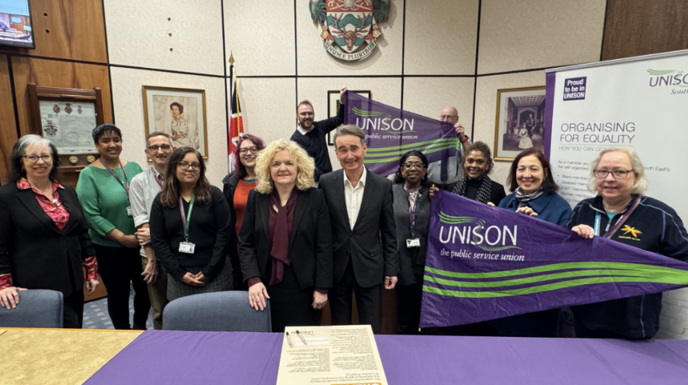 A group of people at Wokingham town hall signing UNISON's anti-racism charter