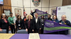 A group of people at Wokingham town hall signing UNISON's anti-racism charter