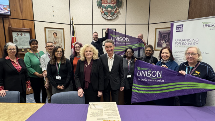A group of people at Wokingham town hall signing UNISON's anti-racism charter